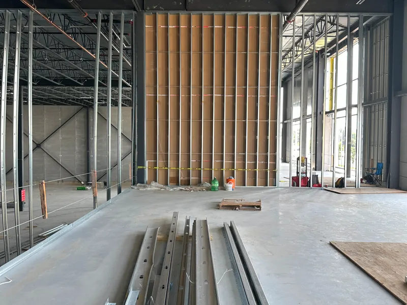 interior of a commercial building with a large fire-rated demising wall