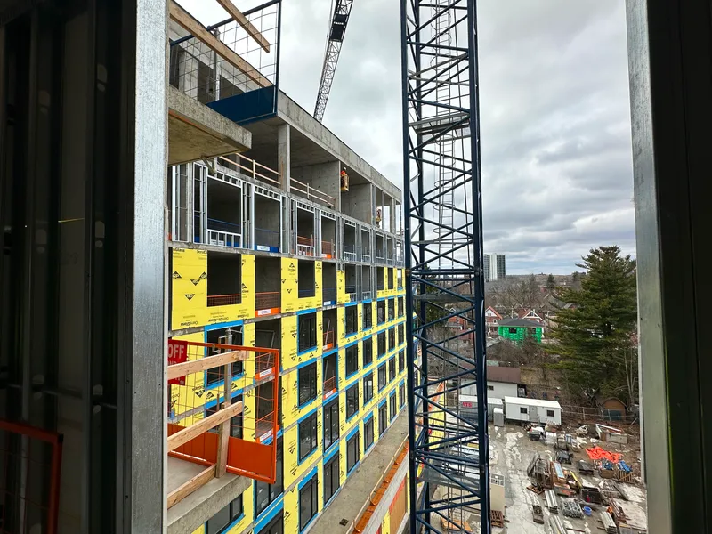 tall building with infill studs at exterior wall