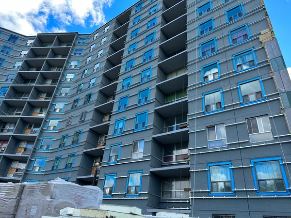 tall residential building with tch re-cladding