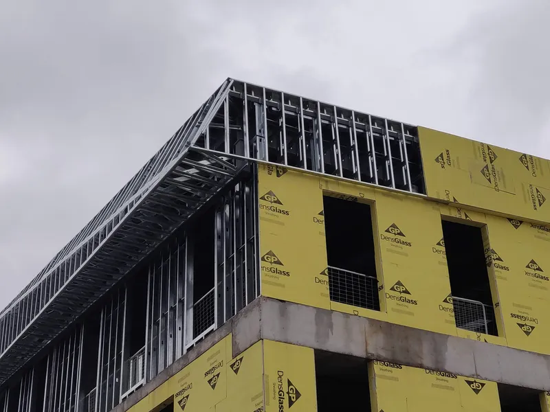 building with sloped soffit and parapet