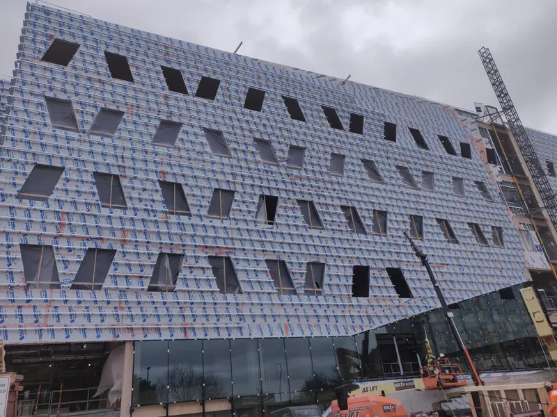 college building with steel studs framing at window opening