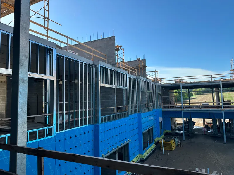 campus residence with steel stud framing at soffit and parapet 