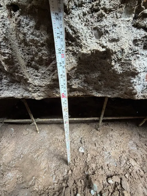 basement foundation measurement with tape measure